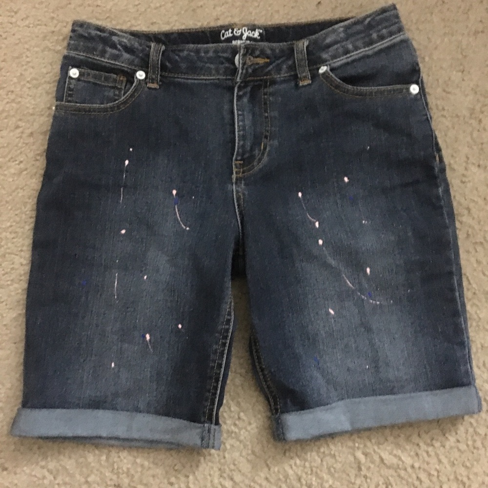 Denim shorts with paint splatters